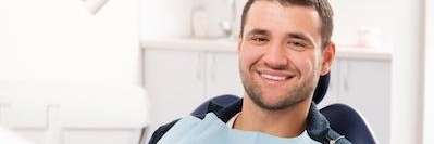 man smiling in dental chair